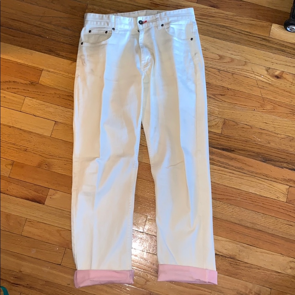 White denim jeans with pink cuffs